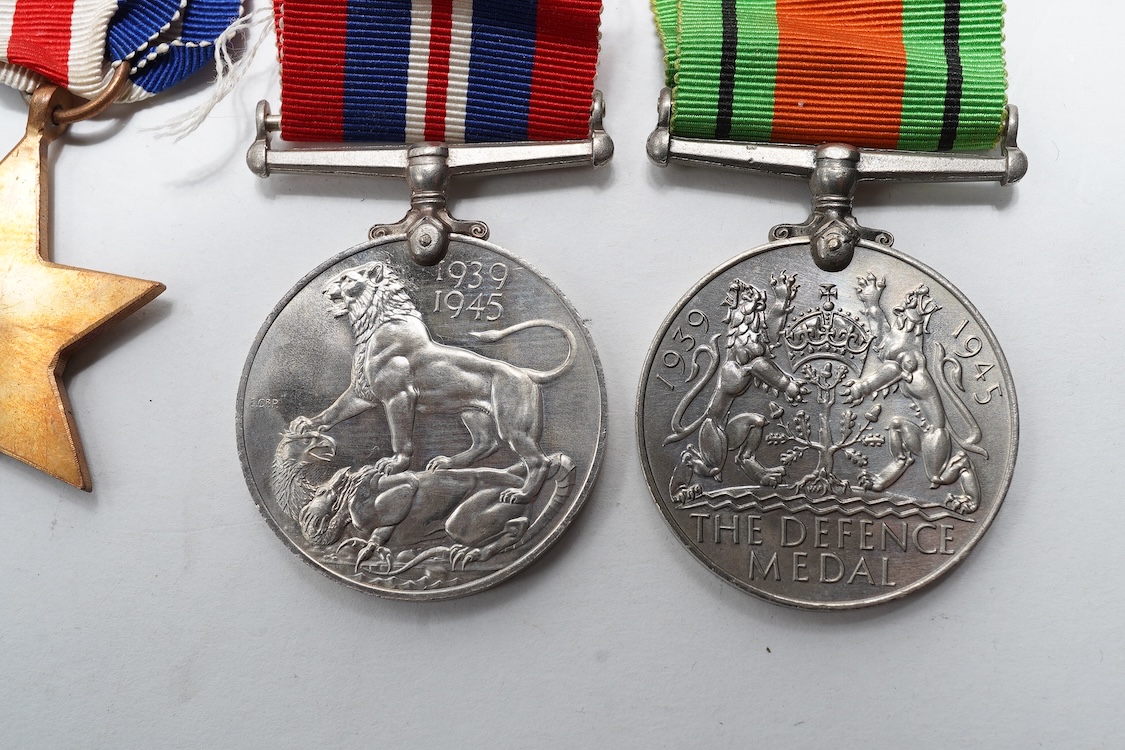 A First World War Mons Star trio awarded to Capt. A.D. Lowdell, with a clasp for 5th Aug-22nd Nov 1914, and oakleaf - mention in dispatches, together with the miniature set, plus a WWII Defence medal in its original card